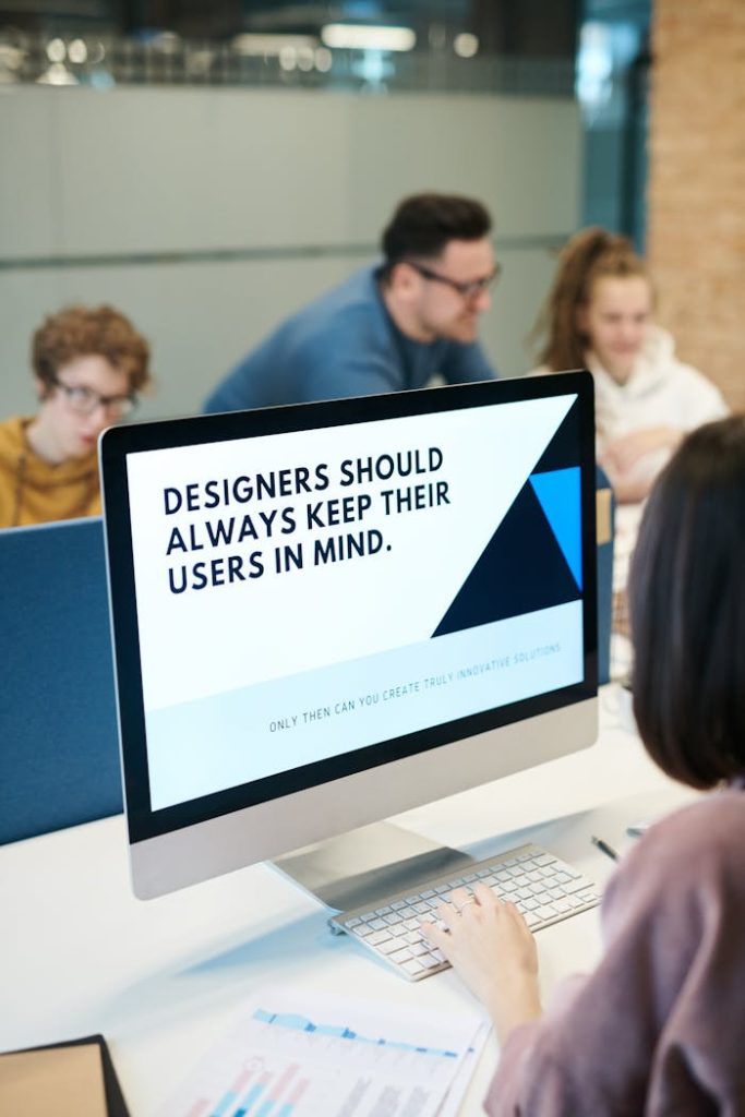 people-inside-building-3184455 Group of designers collaborating in modern office space with computer.